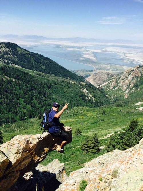 boy sitting on outcrop